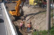 4 Construction Workers are excavating at the work-in-progress construction site of the State Road 134 & Hollywood Way Interchange Project