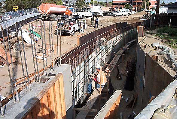 Construction worker is working alone at the work-in-progress construction site of the SR-134 & Hollywood Way interchange